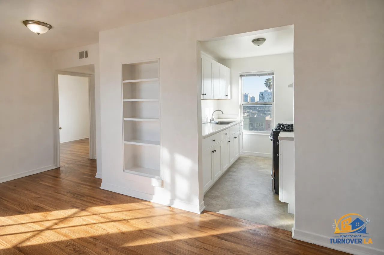 Freshly cleaned LA apartment kitchen and living room after turnover cleaning with spotless counters and floors in natural light
